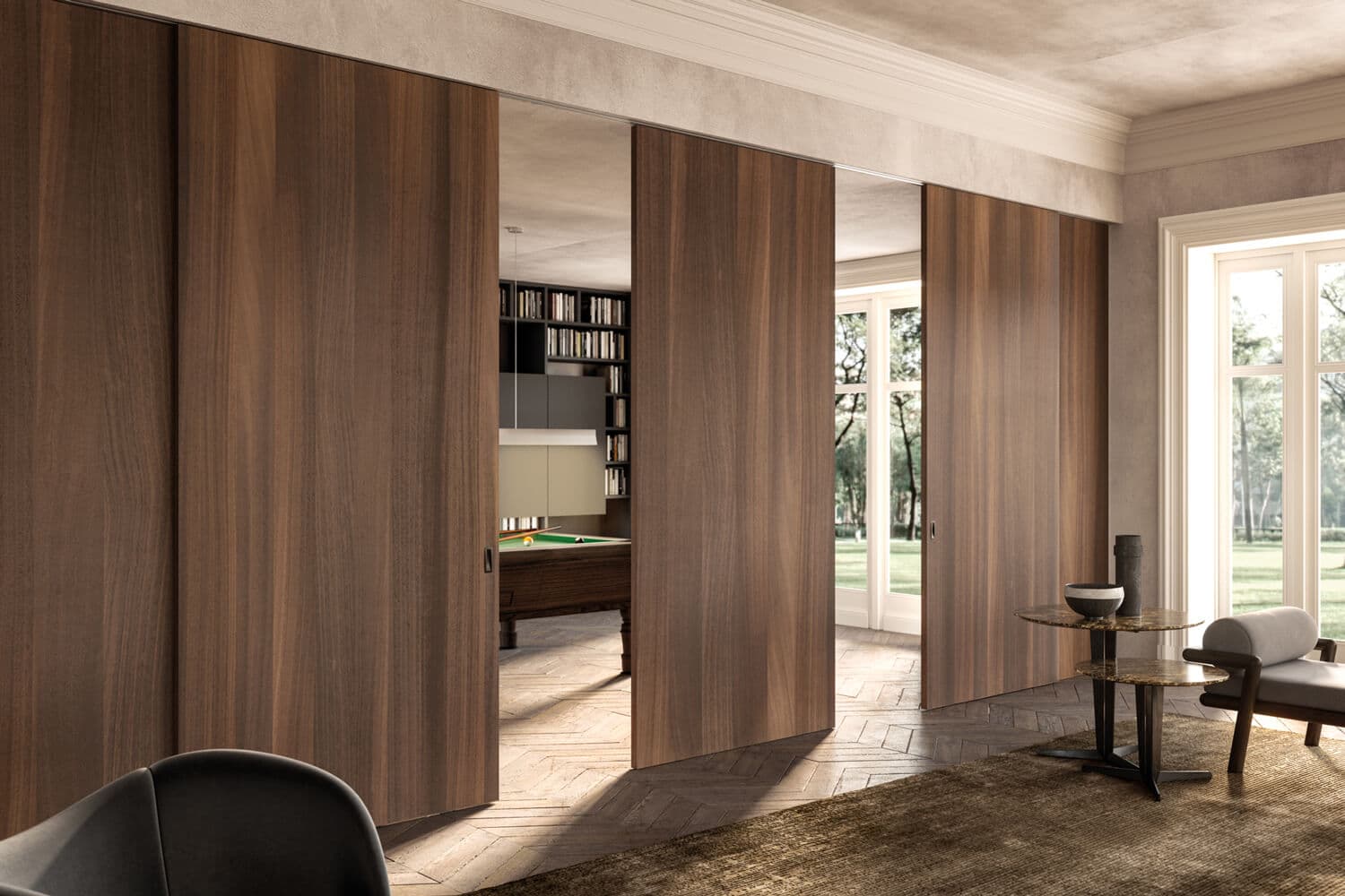 The Adela interior door system allows you to create practical and sophisticated partitions for an open floorplan. The minimalist door design lets the wood finish make a statement. Shown: Eucalyptus finish with Moka handles. Sliding doors on outer surface of the matching wall.