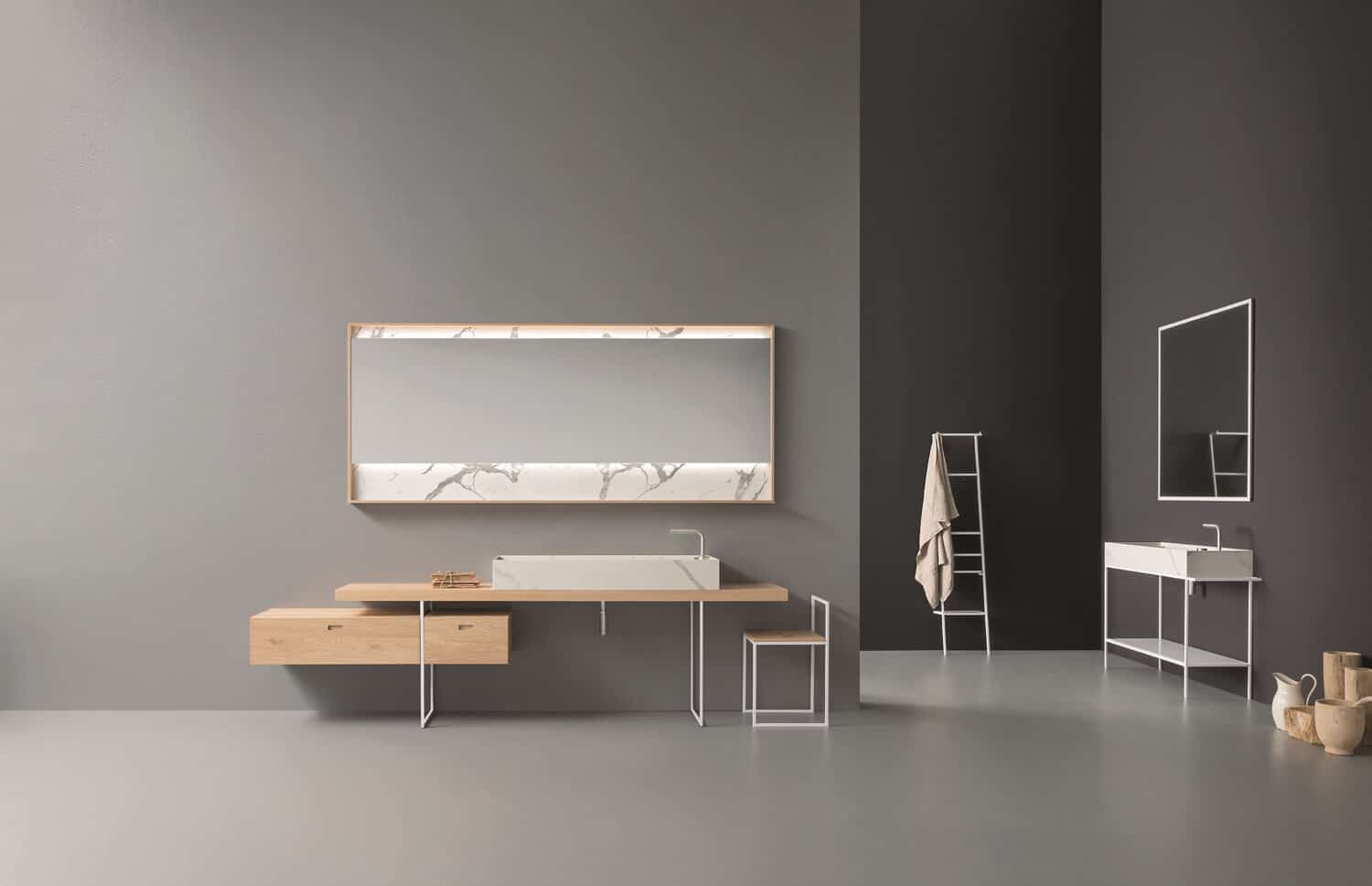 Rovere Naturale wood veneer (cabinets and top) and Statuario Bianco Laminam (washbasin) create an elegant contrast.