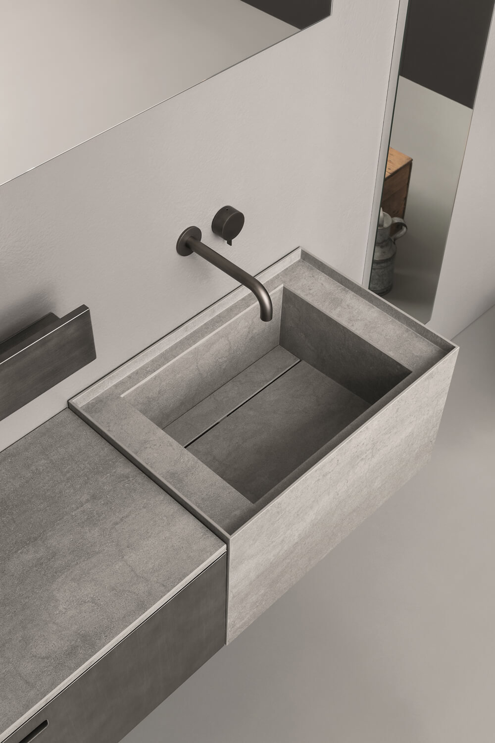 Washbasin and top in Savoia Grigia Laminam; easy to clean, hygienic, resistant to scratches and impact, and impermeable to acids, water, and oil. 