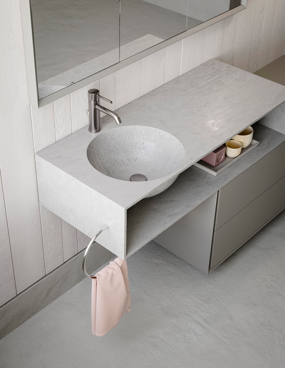 A thick steel ring mounted on the top functions as towel rail. Integrated Pianeta washbasin.
