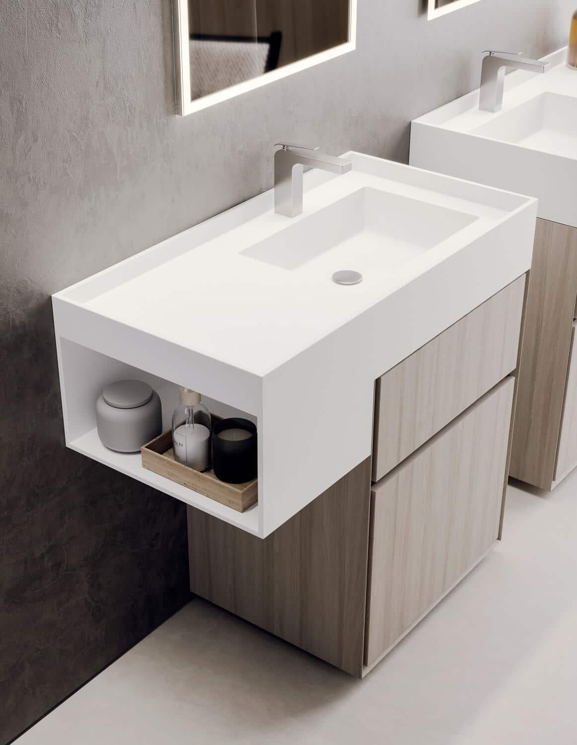 Detail of the side storage unit for frequently used items and the washbasin with all-around anti-drip lip.