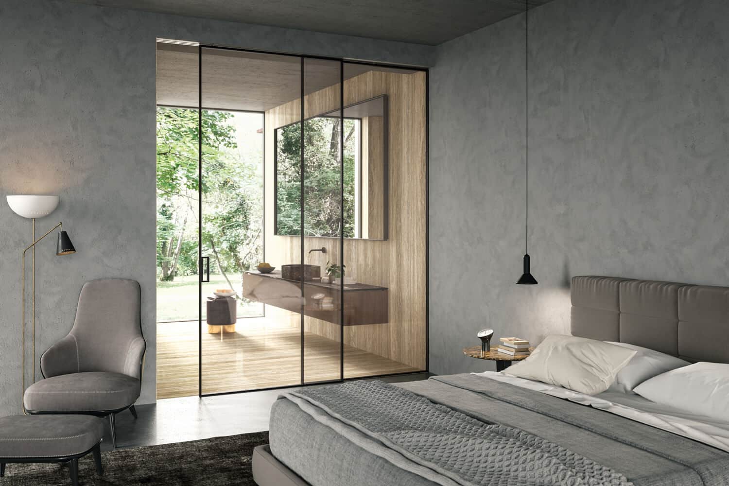 The minimalist Manhattan door in clear glass with Black finish provides both separation and continuity between the bedroom and the master bath, while expanding the room. The sliding door system allows you to make full use of the space.