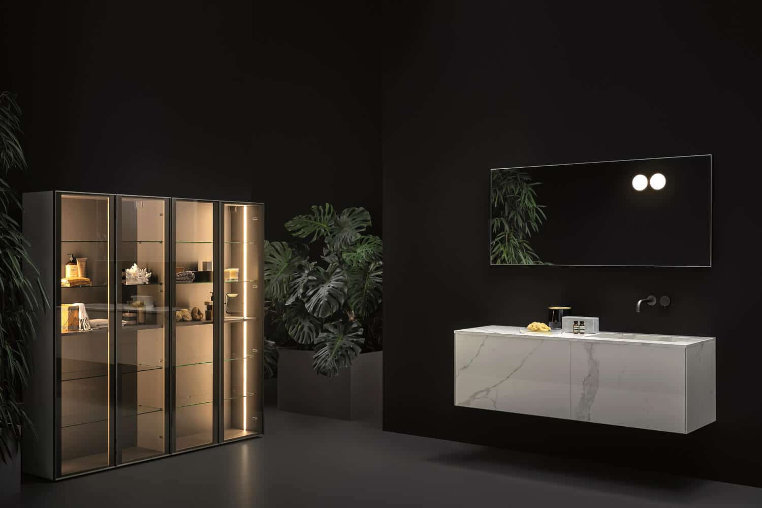 The Statuario Bianco ceramic finish wraps vanities, top, and integrated washbasin in a cohesive look.  Storage unit in burnished glass with Titanium aluminum frame.