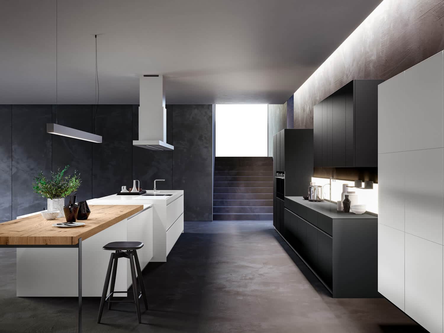 T16 kitchen island in Bianco K KRION™ K-Life. Yota base, tall, and upper cabinets in Nero carbon lacquer. 