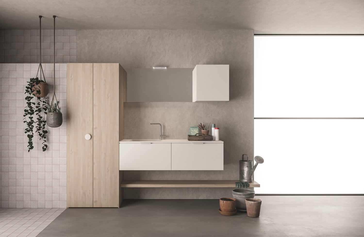 The tall unit hides washer and dryer, and is complemented by a matching shelf and storage cabinets. The minimalist handles of the floating cabinets are paired with the round handles available for the tall cabinets. 