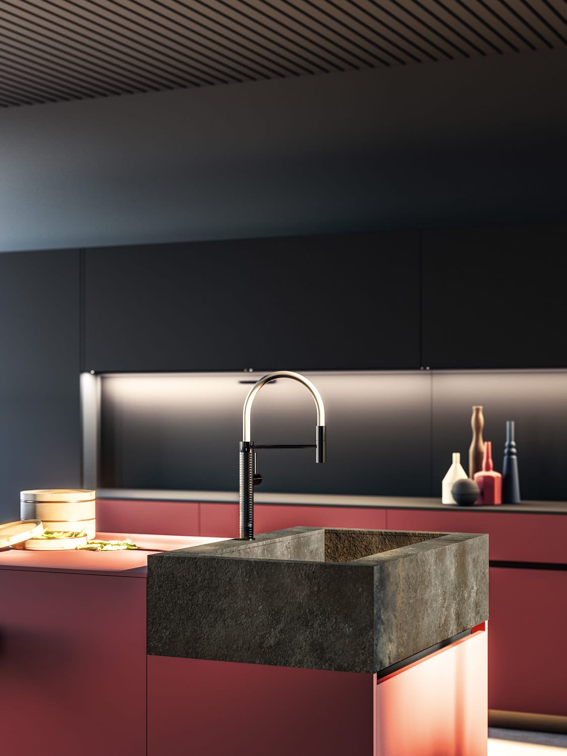 The stoneware sink on the island gives this Tau kitchen an extra contemporary touch, creating a contrast of textures with the smooth Fenix finish of the cabinets.
