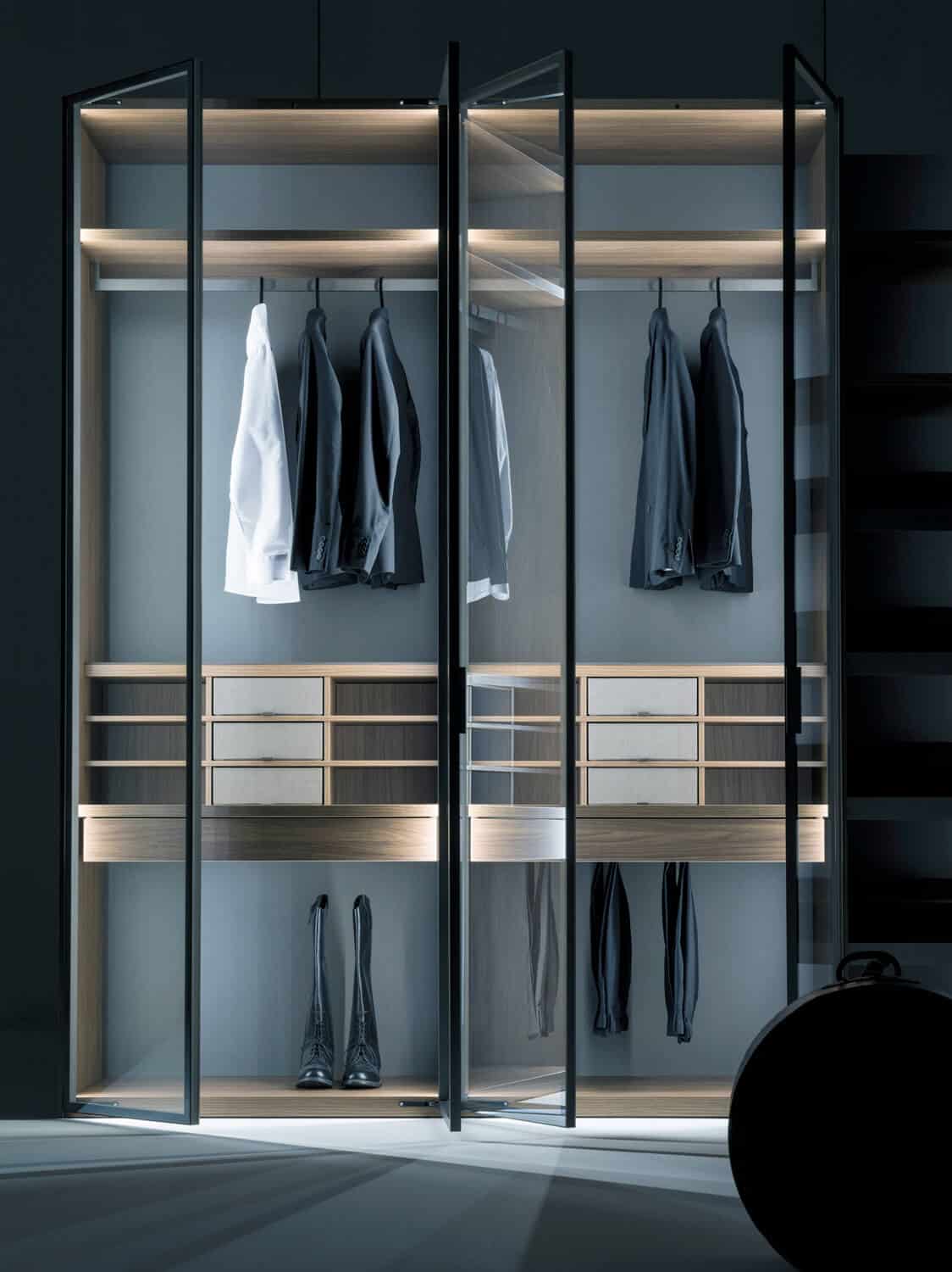 Core framed swing doors in silver stop-sol glass. Customization modules include open grids between the shelves, with or without fabric-covered drawers.