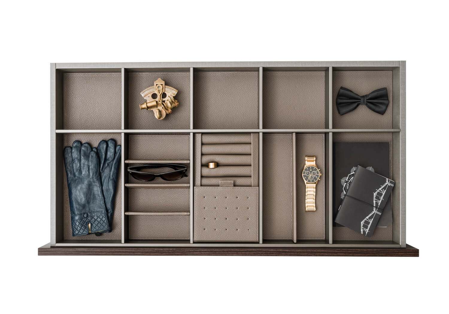 The drawers are customizable with inserts for jewelry, ties, and other fashion accessories.