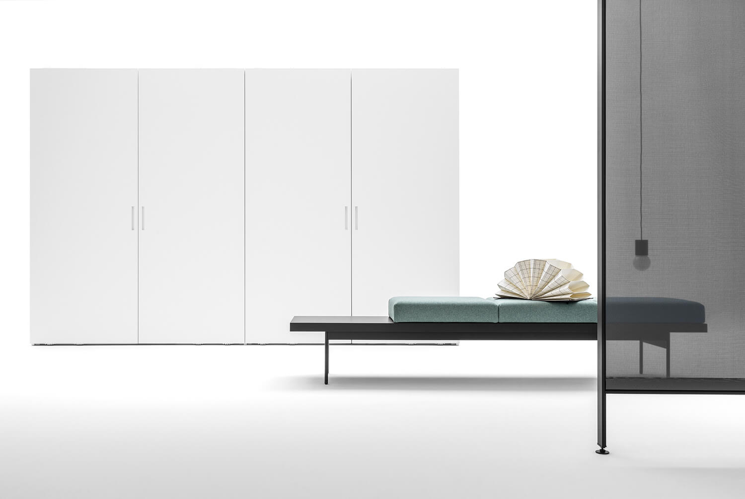 Core closet in Bianconeve matte lacquer with flush sliding doors.