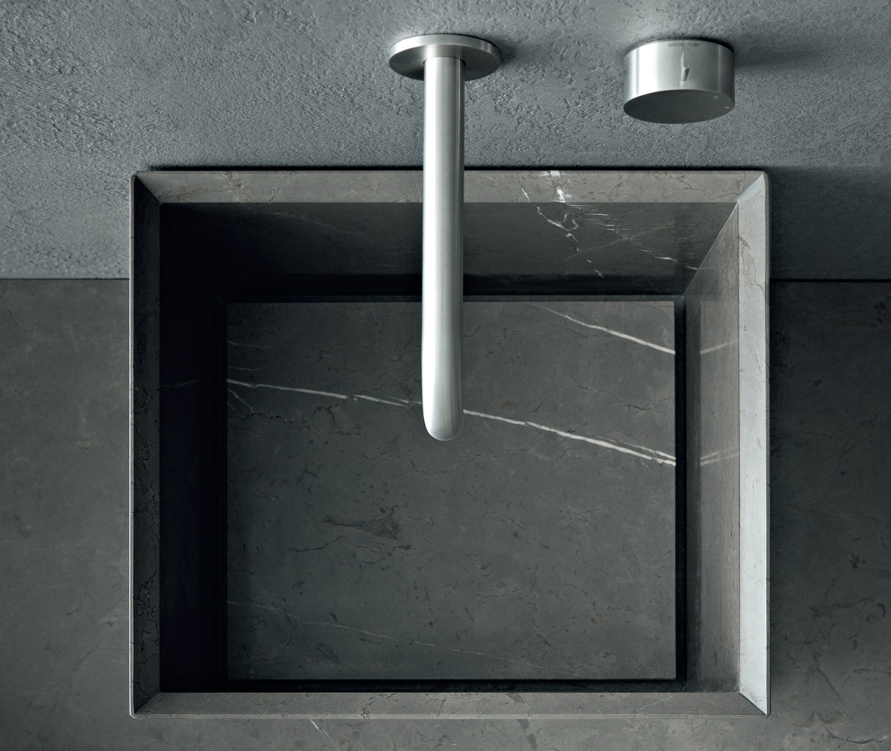 Over-the-counter washbasin in Pietra Gray marble.