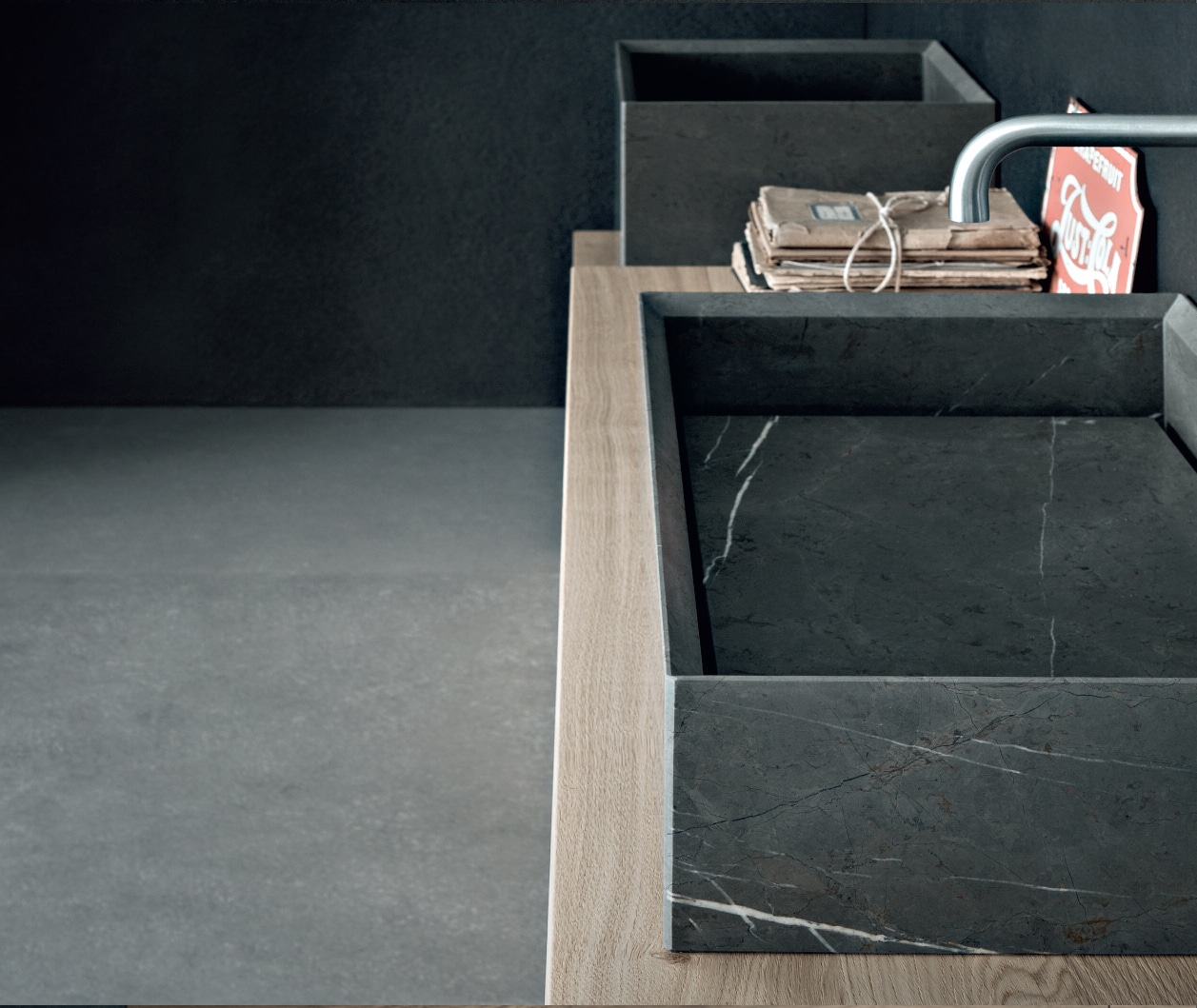 Over-the-counter washbasin in Pietra Gray marble.