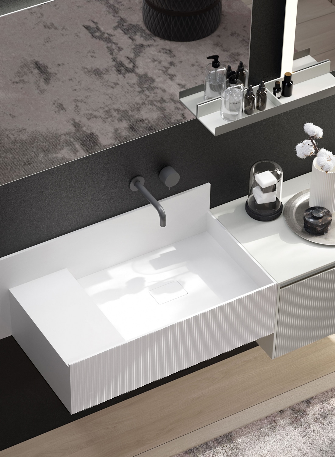 Teknorit washbasin with protective lip and the plissé front that is characteristic of the D’Art bathroom line. 