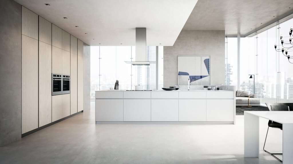 Modern kitchen with white cabinets, a large island, and a view of the city.