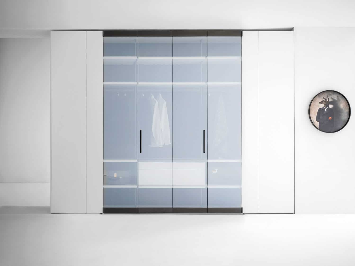 The transparency of the bifold glass doors increases the aesthetic value of the closet.