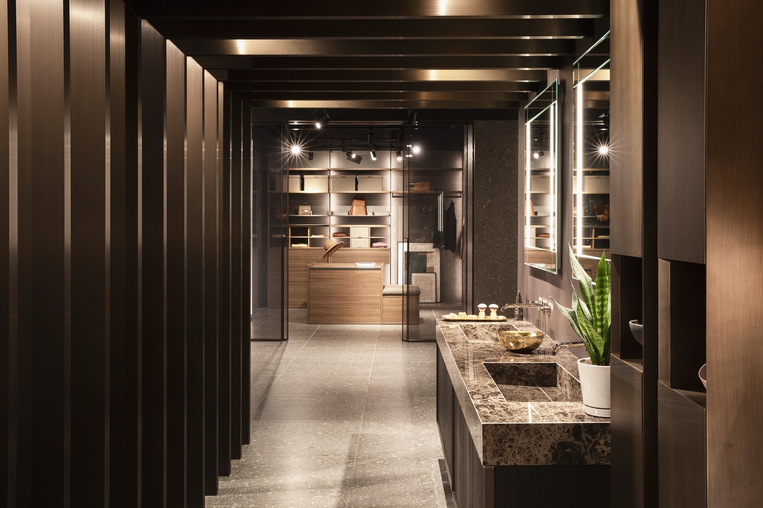 Bathroom and closet cabinetry within the showroom design by Italian architect, Mario Mazzer.