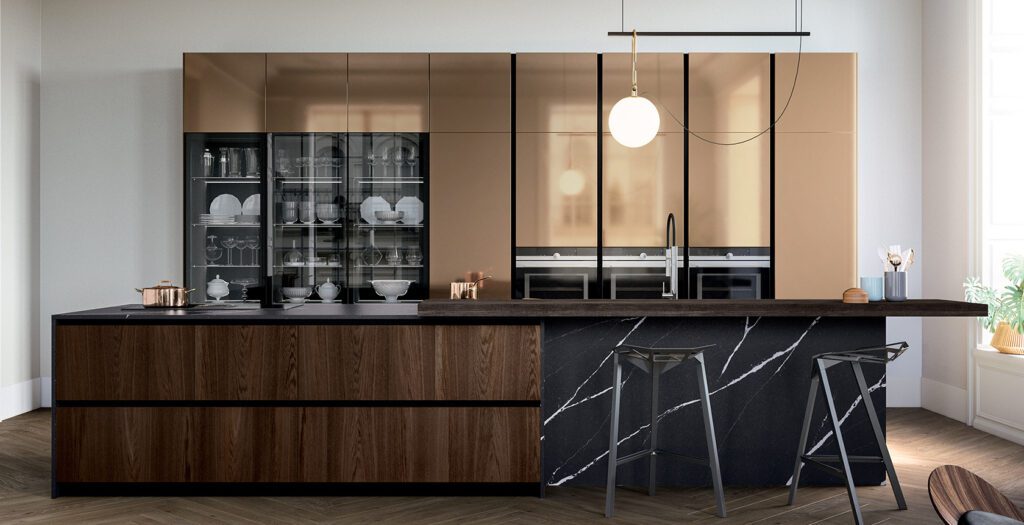 Modern kitchen with gold cabinets, a marble countertop, and a wooden island.