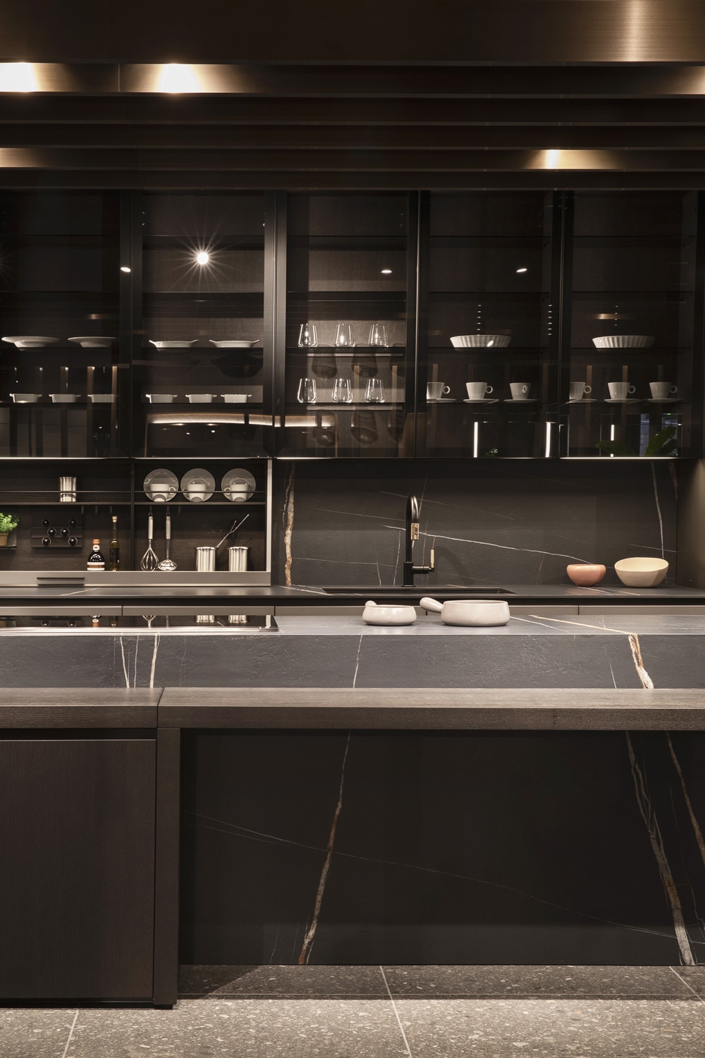Luxury modern kitchen with china cabinets in framed fume' glass and Mover storage system for the backsplash.