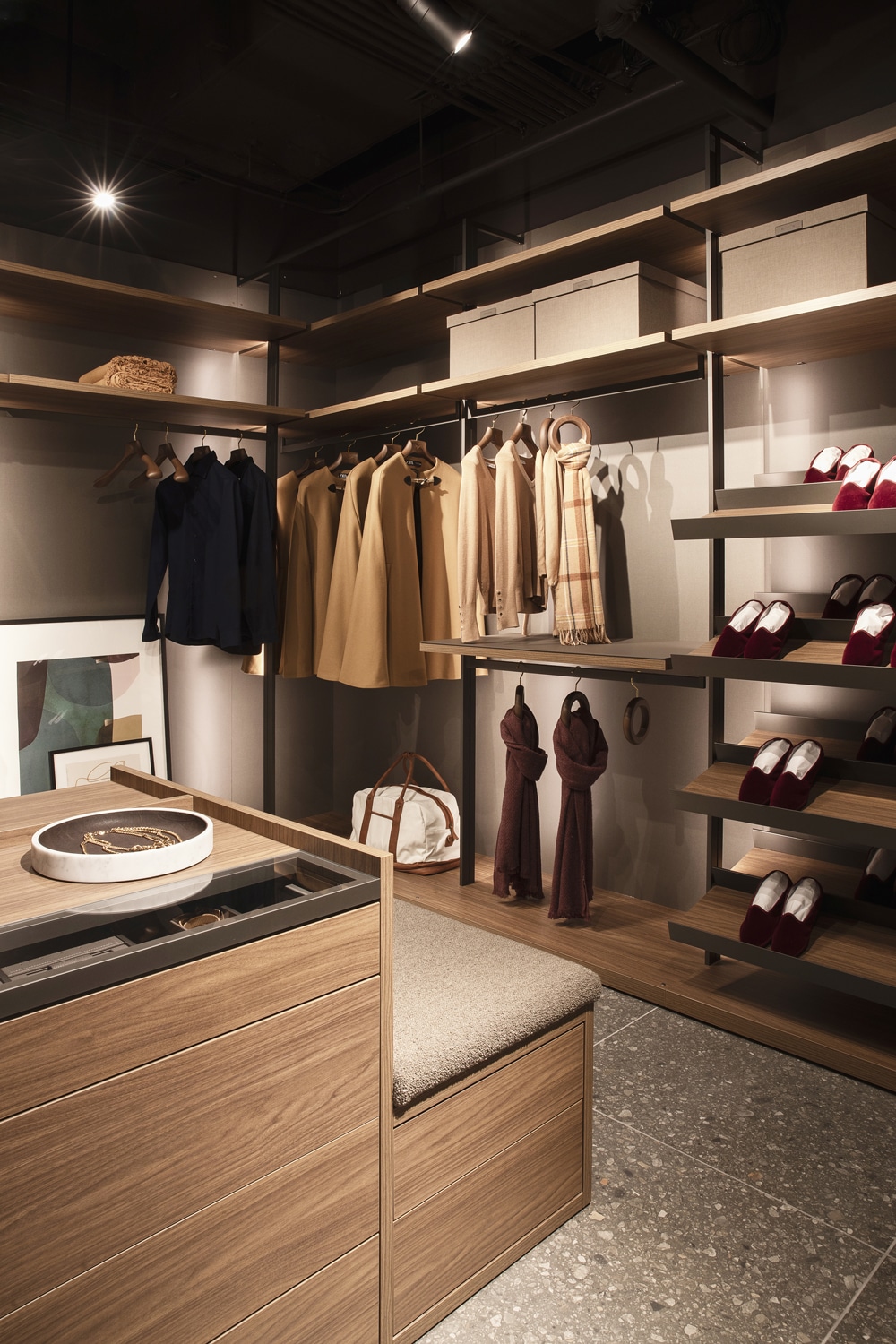 Cabina custom walk-in closet design with double-sided island for the middle of the room.