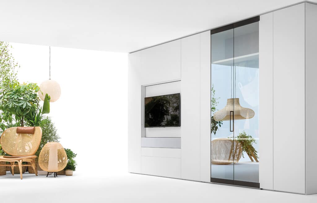 Luxury closet with added TV module concealing media storage inside the TV panel