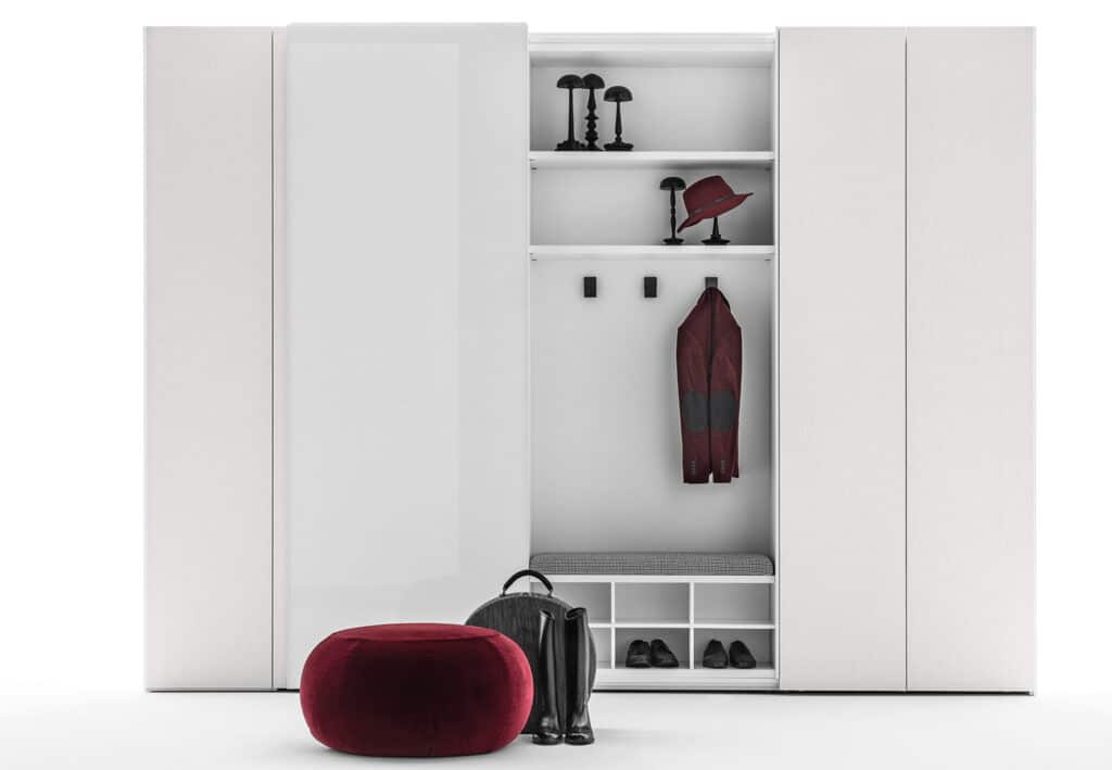 Custom luxury closet with sliding doors in white wood. Central sliding door in mirrored glass.