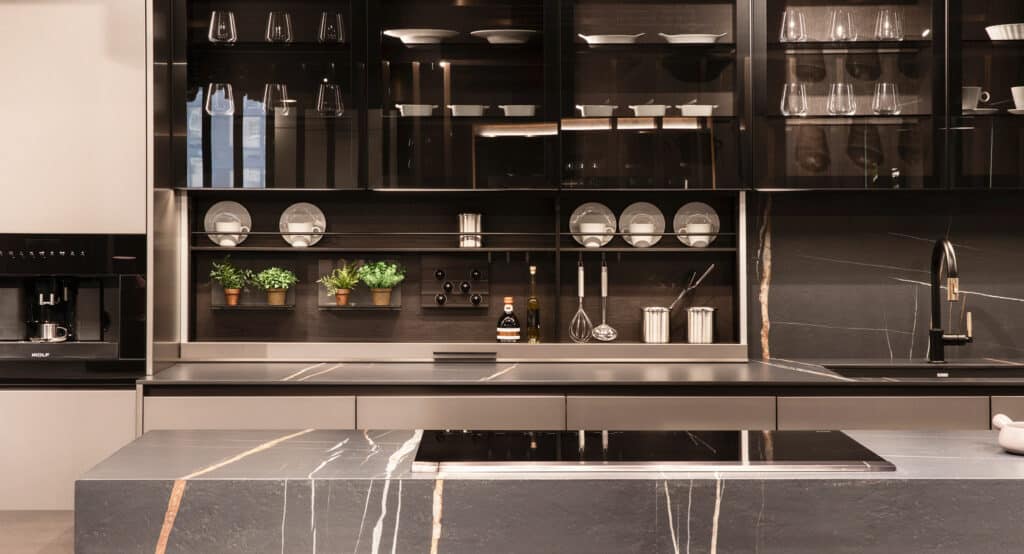 Luxury kitchen in dark tones with hidden backsplash storage