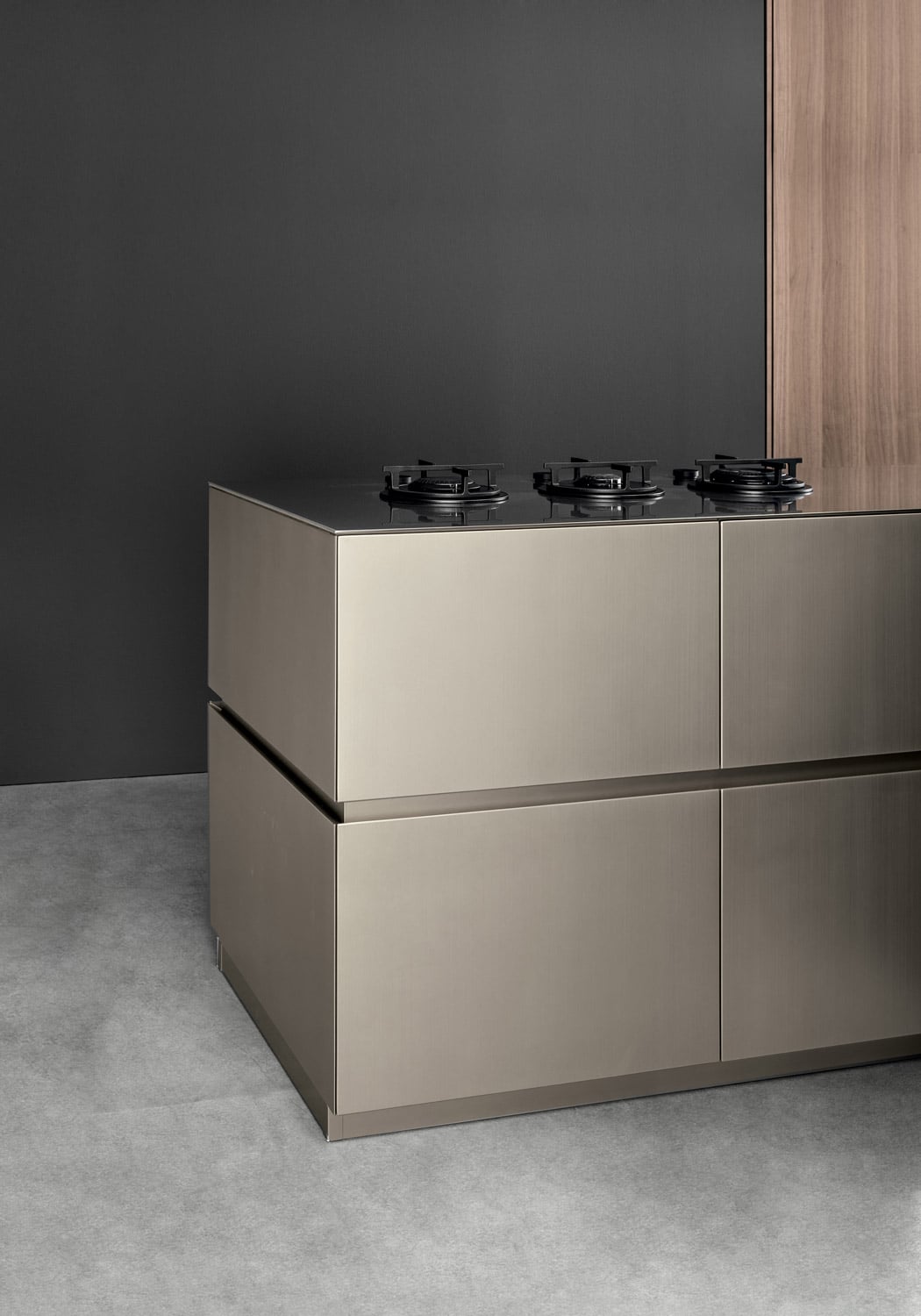 The uninterrupted channel along the perimeter of the island is a contemporary detail enhanced by the use of the same finish on cabinets, channel, and toe kick.
