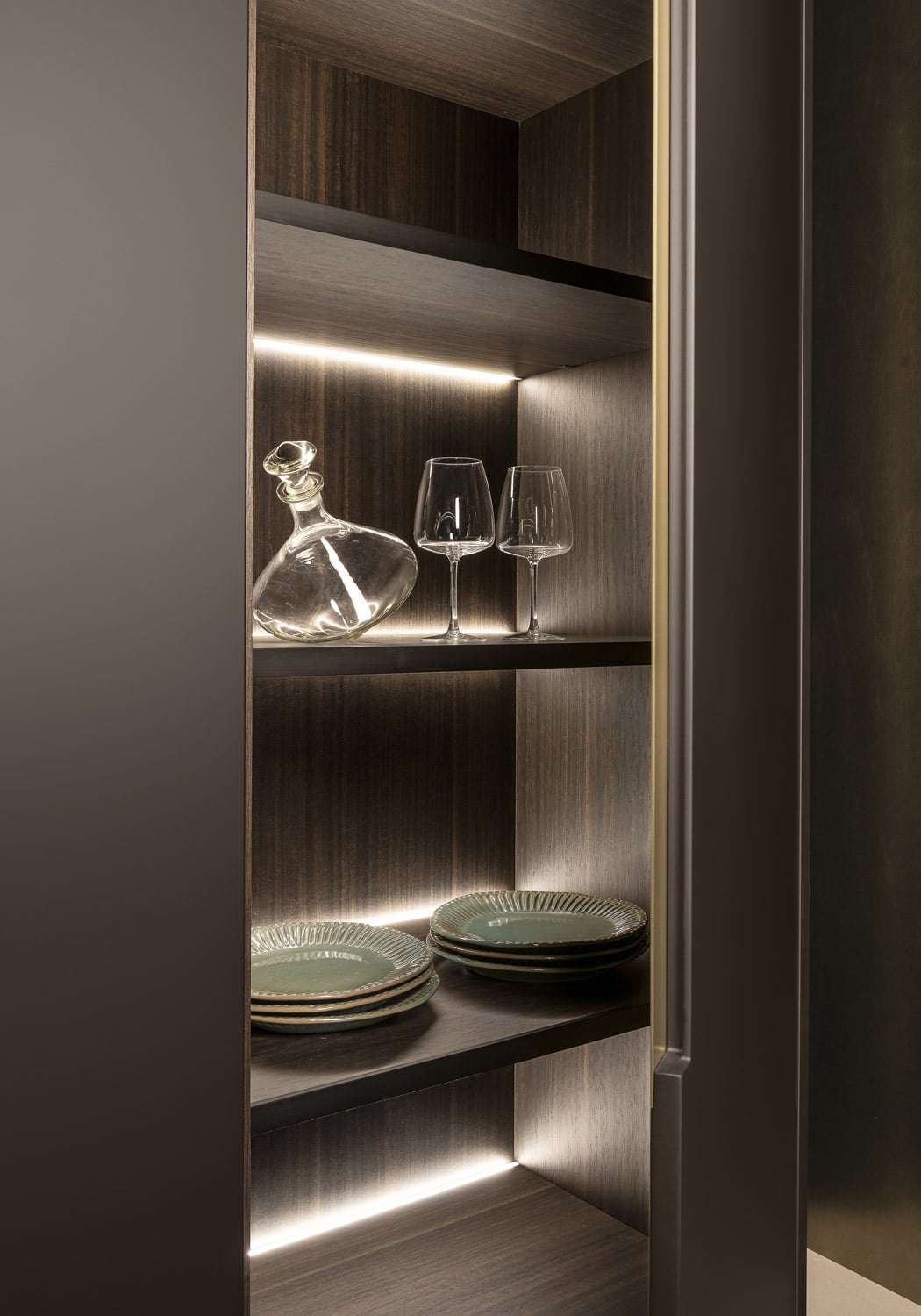 The pantry cabinets feature ad-hoc LED lighting that activates when the door opens.