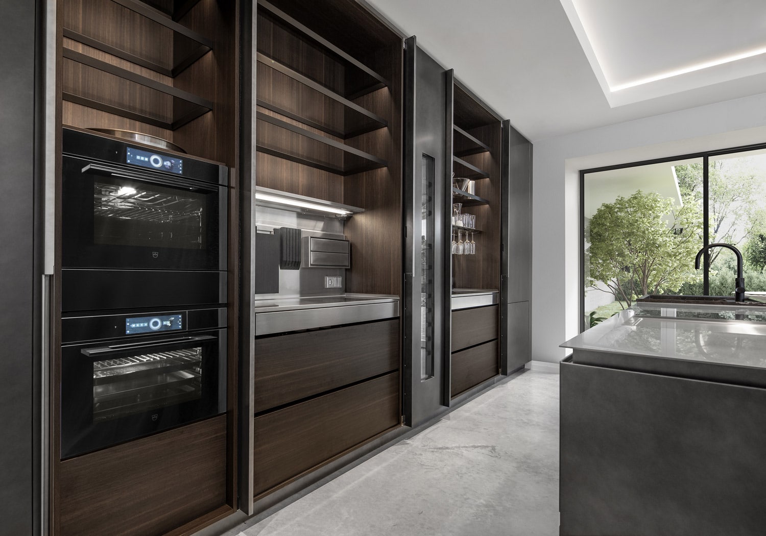 Used on most of the tall units, the pocket doors fold out of the way to give full access to the contents of the units, which are customized to provide distinct – and elegant - workstations within the kitchen.  