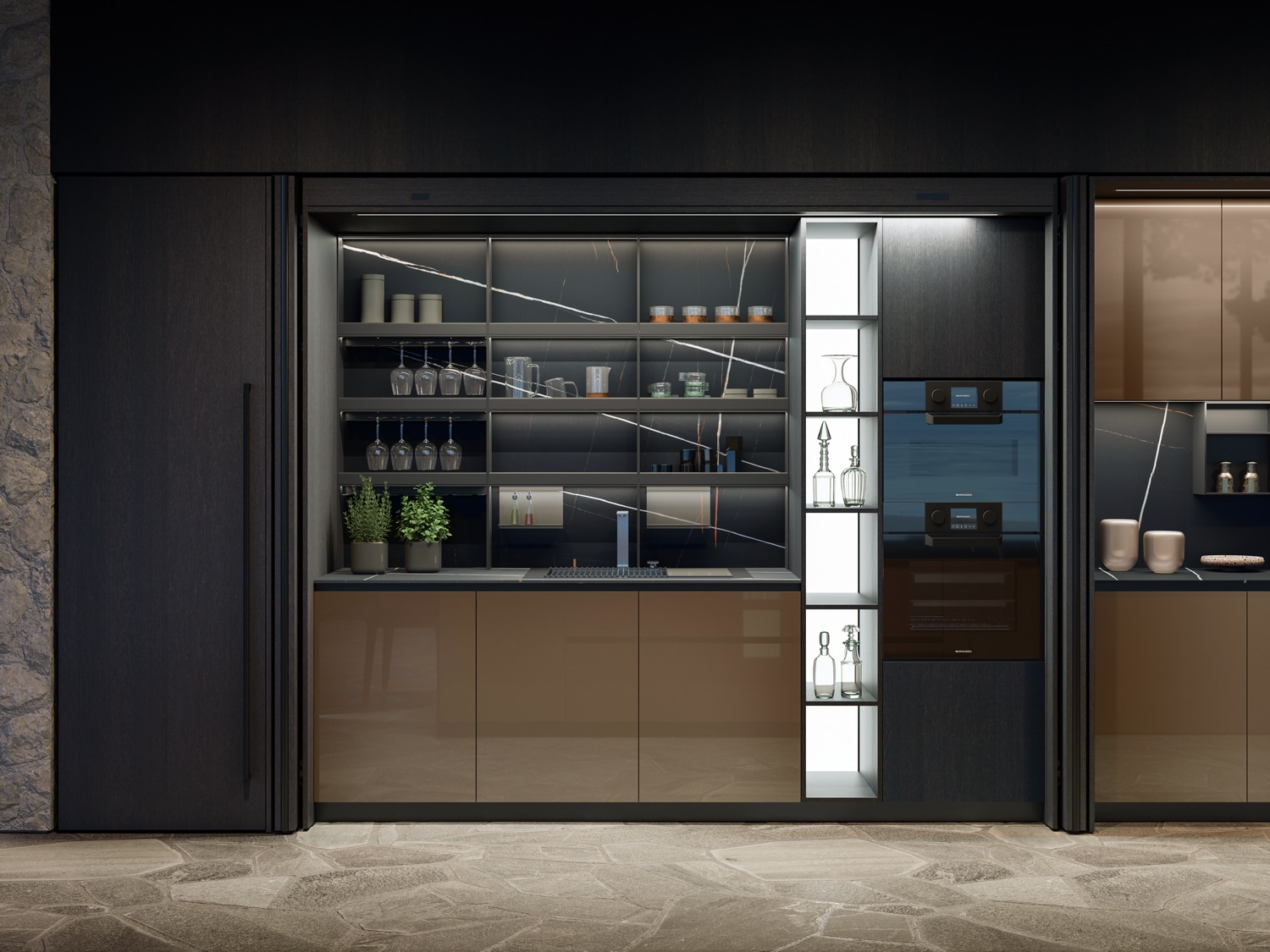 Ambient and functional lights draw attention to the unit, which lives in full harmony with the rest of the kitchen through the use of the same finishes. 