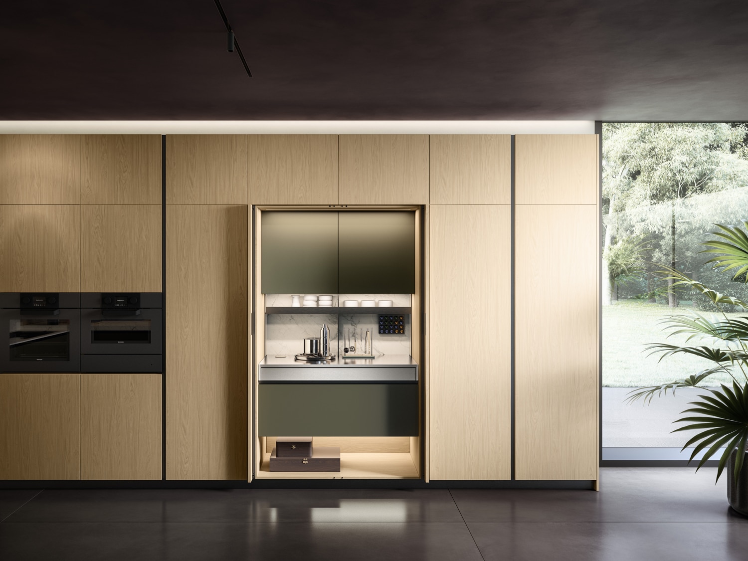 Wing workstation and storage system with pocket doors. Interiors in Verde Foresta matte lacquer and Statuarietto Laminam, in harmony with the rest of the kitchen. A full pull-out stainless steel top extends the usable work surface of the unit.