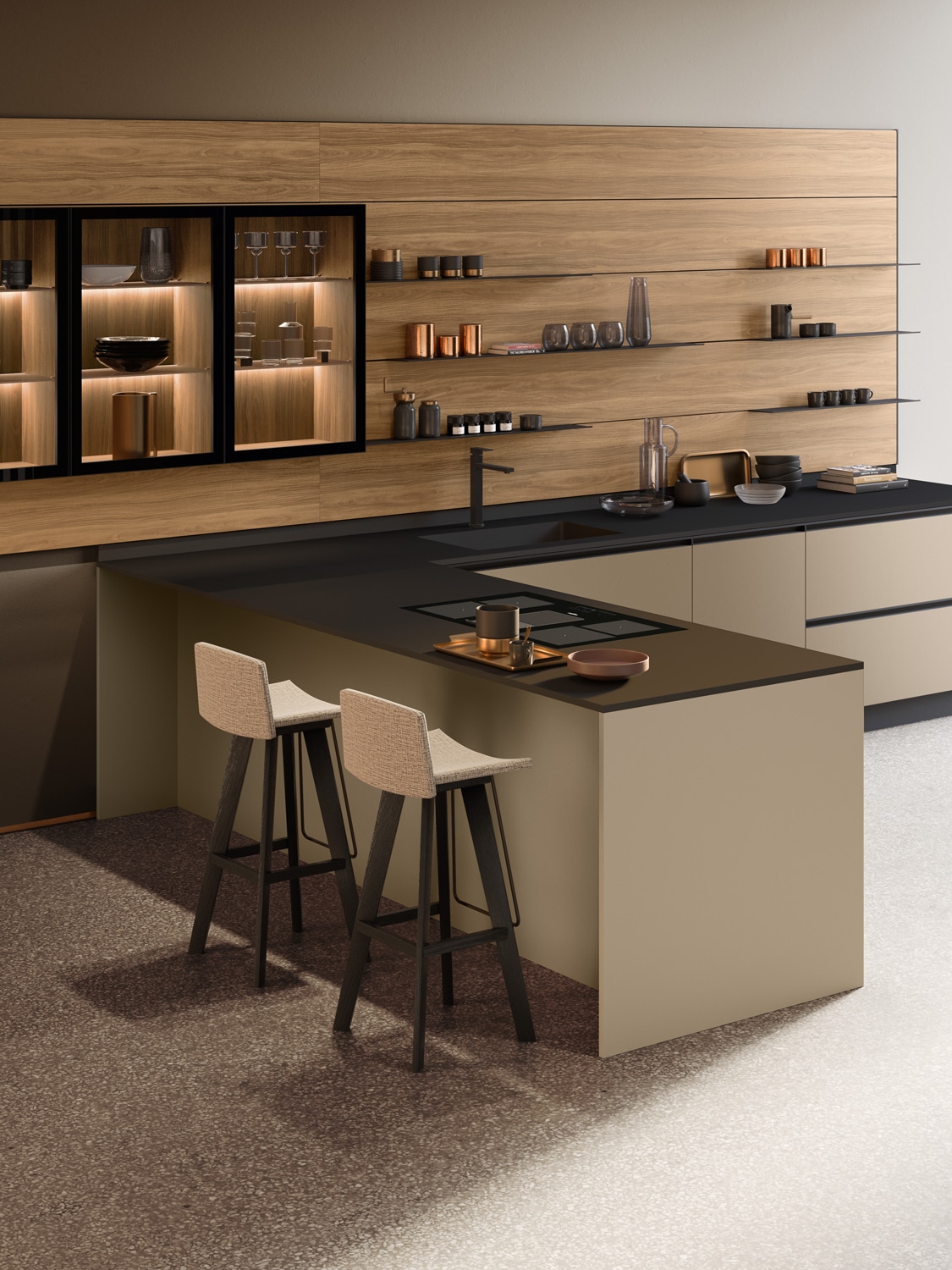The Infinity boiserie in Noce (Walnut) Caramel melamine features minimalist open shelves in Black anodized aluminum. The same finishes are used on the glass cabinets, creating an elegant display area on the wall that harmonizes the kitchen with the living room. 