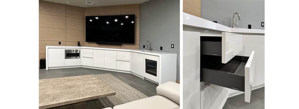 Modern home theater room with a wet bar and white cabinetry.