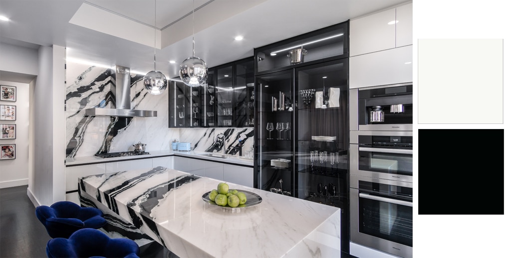 Modern kitchen with black and white marble countertops and a white and black color scheme.