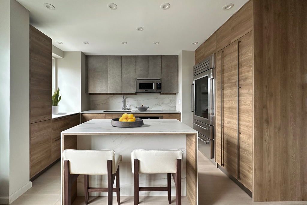 Modern kitchen with wood cabinets, marble countertops, and a kitchen island. Modern kitchen with wood cabinets, marble countertops, and a kitchen island.