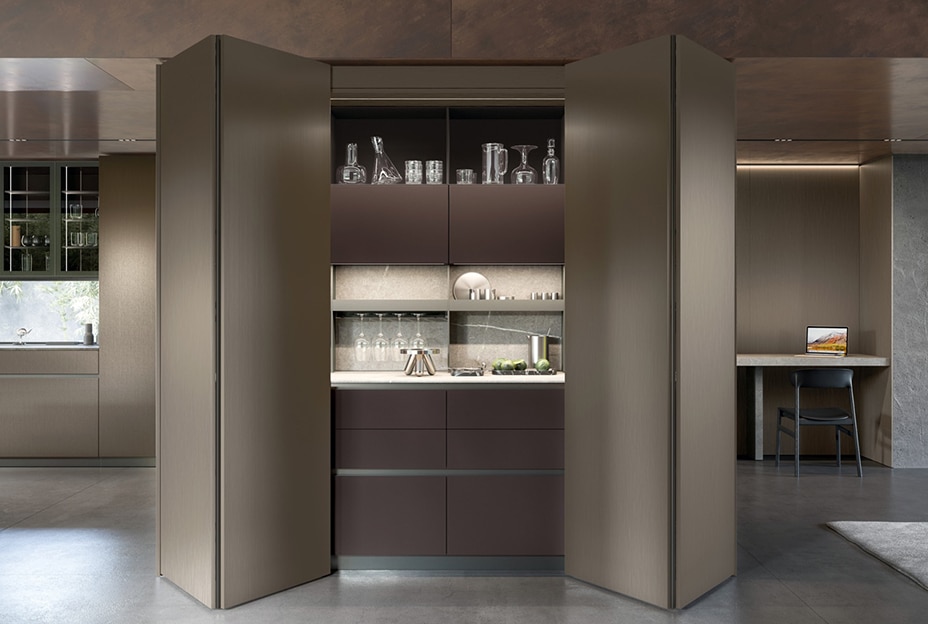 Modern kitchen with a hidden bar unit that can be opened and closed with folding doors.