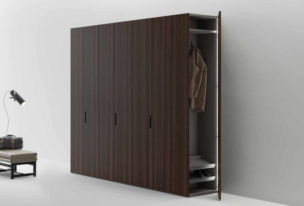 Modern closet in dark wood with side opening door to maximize storage space