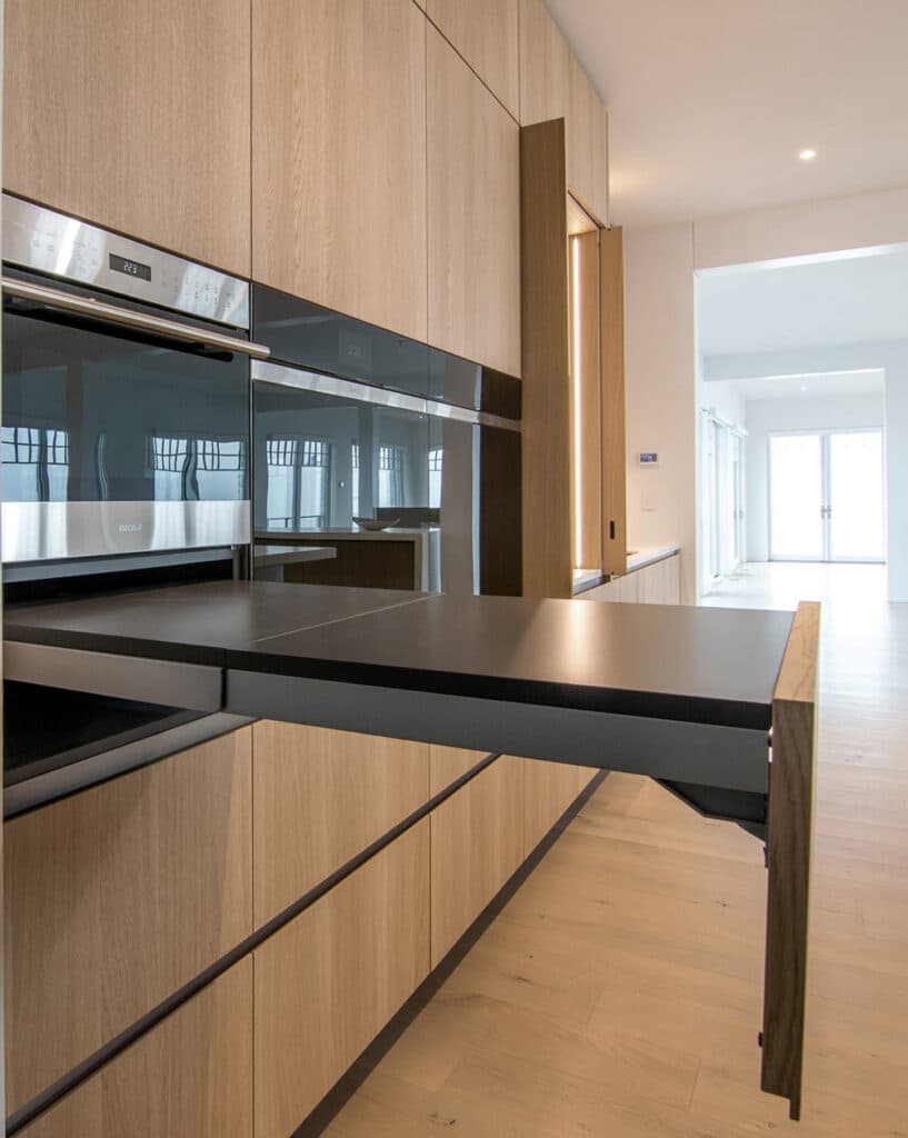 Custom pull-out table built under the kitchen oven