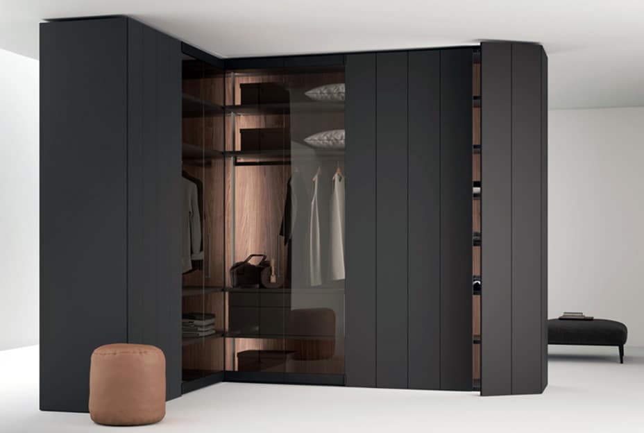 Modern walk-in closet with sliding doors and organized storage.