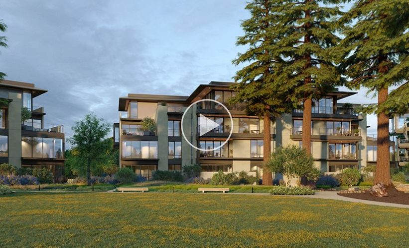 apartment building with a green lawn and tall trees.